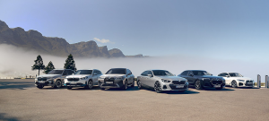 BMW electric and luxury car lineup with mountain background