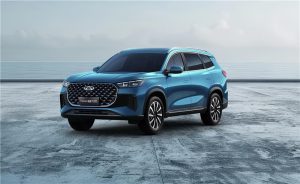 Chery Tiggo 8 Pro SUV in metallic blue parked on modern coastal pavement with premium bold exterior design